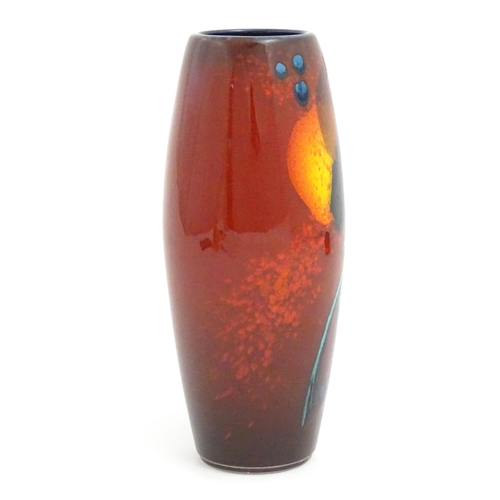 145 - An Alan Clarke studio pottery vase of cylindrical form with abstract red glaze detail. Marked under.... 