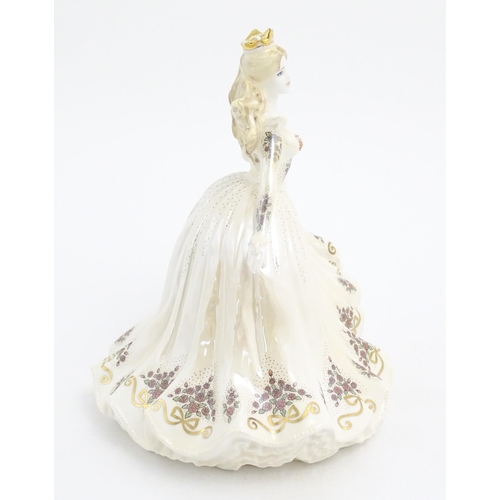 146 - A Coalport limited edition model of Cinderella, no. 24/2000. Marked under. With certificate of authe... 