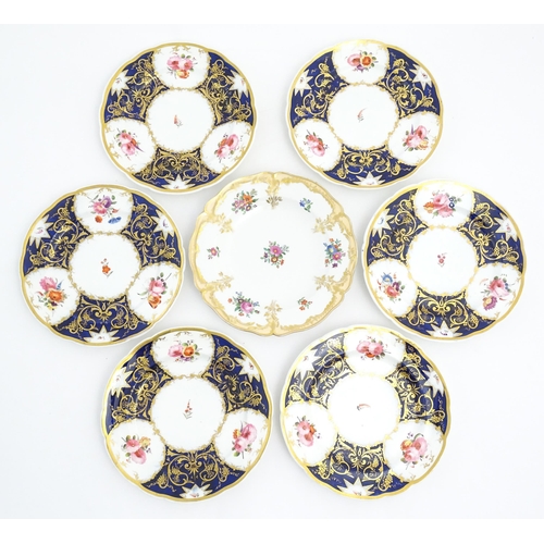 169 - Six 19thC dessert plates with floral and foliate decoration and gilt fruiting vine detail. Together ... 