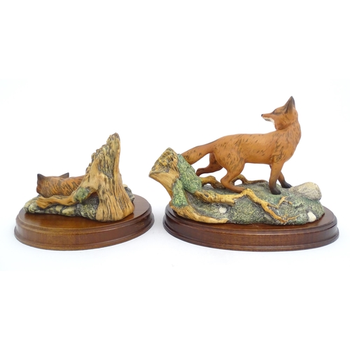 181 - Four Royal Doulton models of animals from the Wildlife collection comprising Fox & Cub, Fox, Otter, ... 