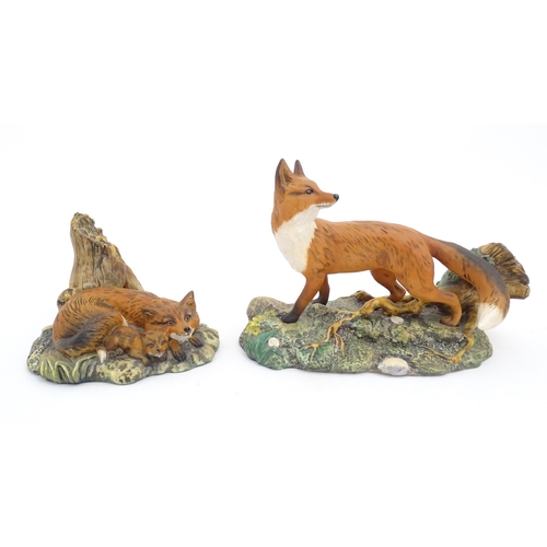 181 - Four Royal Doulton models of animals from the Wildlife collection comprising Fox & Cub, Fox, Otter, ... 