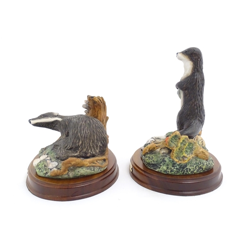 181 - Four Royal Doulton models of animals from the Wildlife collection comprising Fox & Cub, Fox, Otter, ... 