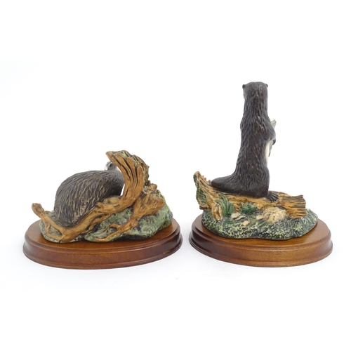 181 - Four Royal Doulton models of animals from the Wildlife collection comprising Fox & Cub, Fox, Otter, ... 