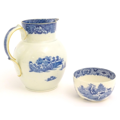 54 - A pearlware blue and white jug decorated with chinoiserie detail with figures, bridge, pagodas, etc.... 