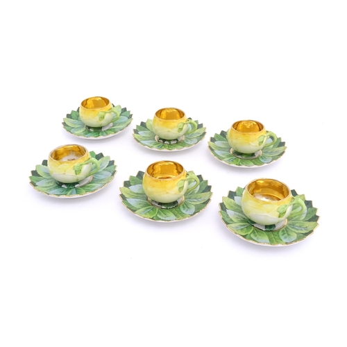 79 - A set of six German yellow rose tea cups and saucers by Car Knoll, Carlsbad, the cups with floral pe... 