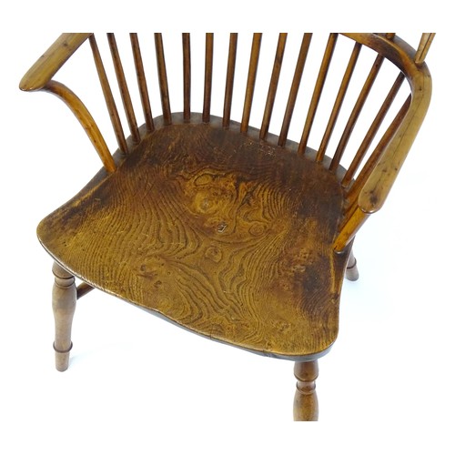 1503 - A late 18thC / early 19thC elm and yew stick back Windsor chair, stamped 'Hubbard, Grantham'. This d... 