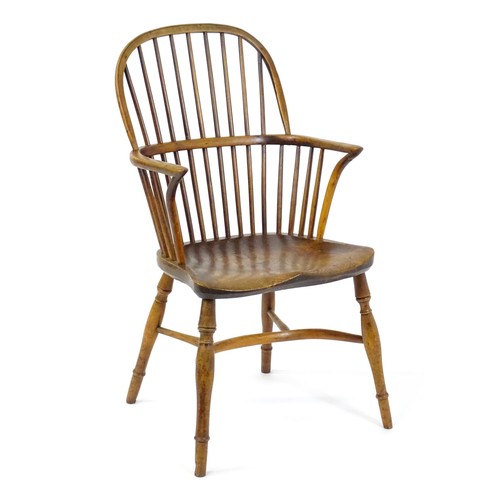 1503 - A late 18thC / early 19thC elm and yew stick back Windsor chair, stamped 'Hubbard, Grantham'. This d... 