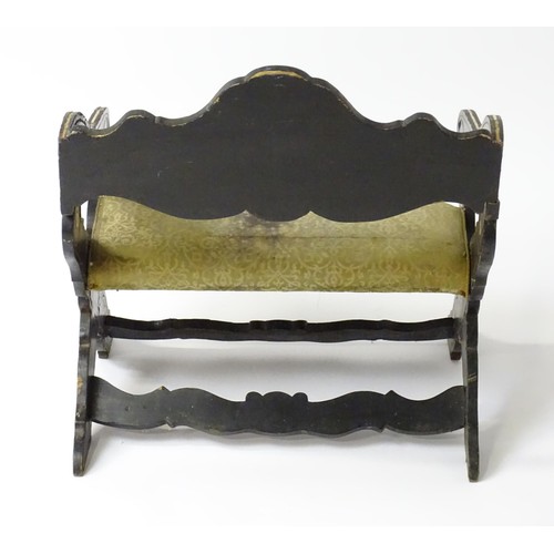 1506 - A late 18thC / early 19thC continental x-frame chair, having an ebonised frame with decorative bone ... 