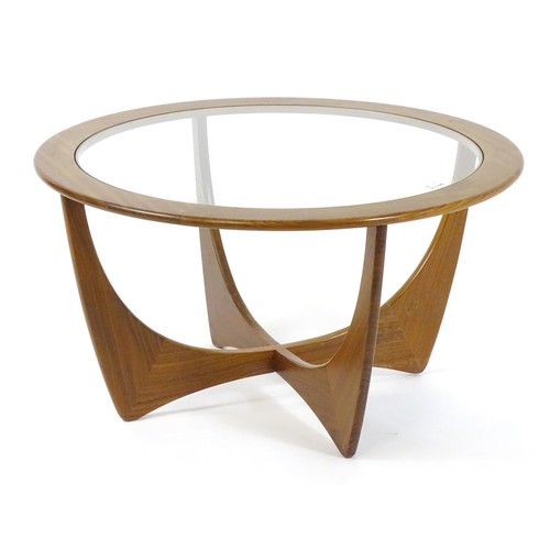 1697 - Vintage / Retro: A mid / late 20thC G Plan 'Astral' coffee table with a circular glass top and teak ... 
