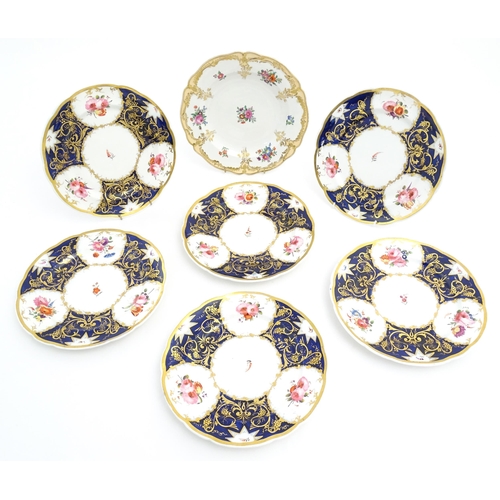 169 - Six 19thC dessert plates with floral and foliate decoration and gilt fruiting vine detail. Together ... 