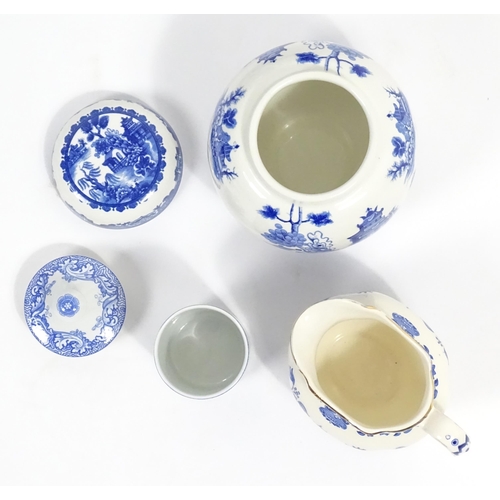 187 - A quantity of assorted blue and white dinner wares to include dinner plates, meat plate, serving dis... 