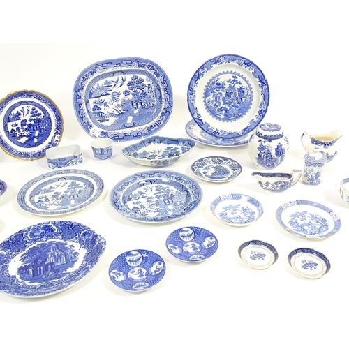 187 - A quantity of assorted blue and white dinner wares to include dinner plates, meat plate, serving dis... 