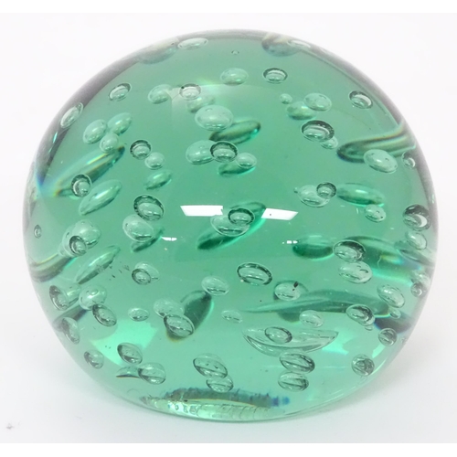 198 - A green glass paperweight / doorstop 4