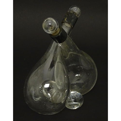 206 - An oil and vinegar bottle of entwined form with silver mounts hallmarked Birmingham 1904, maker John... 