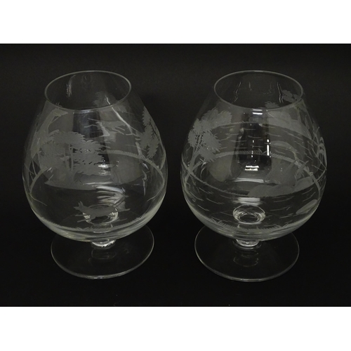 207 - Two drinking glasses / brandy glasses, one with engraved decoration depicting a fisherman, the other... 