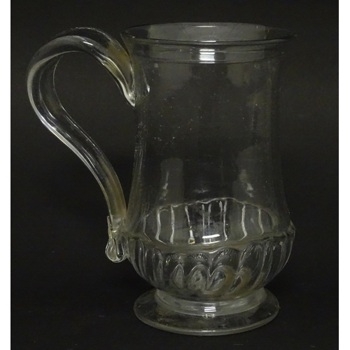 208 - A Georgian glass tankard with loop handle  approx. 5 /2