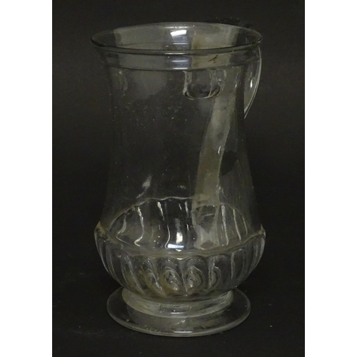 208 - A Georgian glass tankard with loop handle  approx. 5 /2