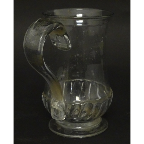 208 - A Georgian glass tankard with loop handle  approx. 5 /2