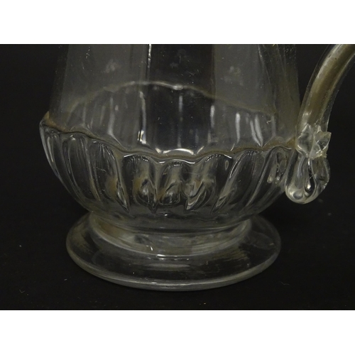 208 - A Georgian glass tankard with loop handle  approx. 5 /2