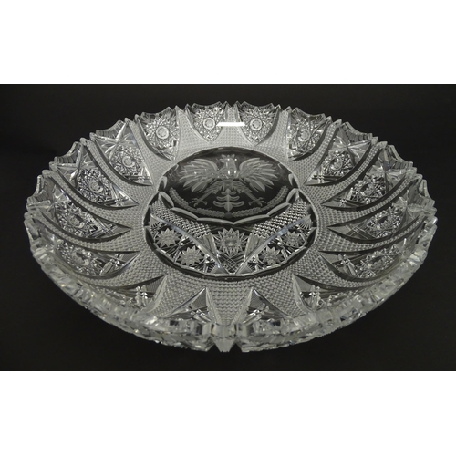 213 - A cut crystal dish with eagle decoration. 12