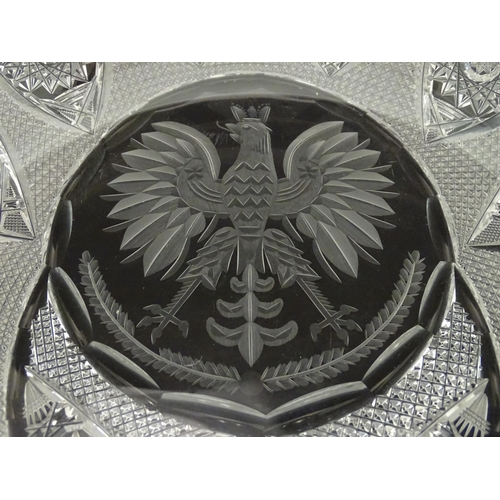 213 - A cut crystal dish with eagle decoration. 12