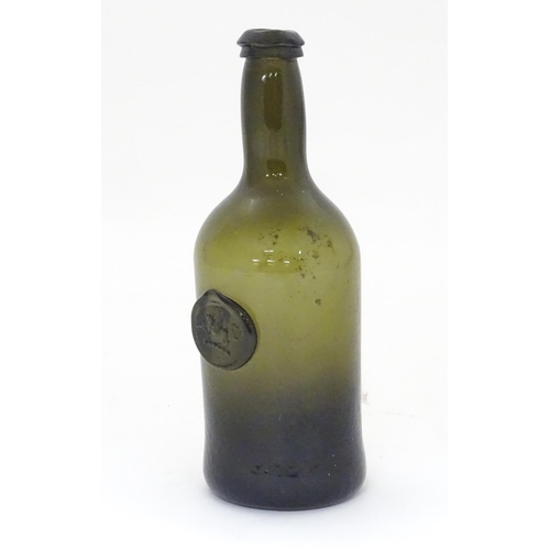 218 - A late 18thC / early 19thC sealed bottle, the light olive glass bottle with dragon seal. ( small siz... 