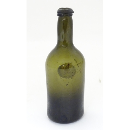 218 - A late 18thC / early 19thC sealed bottle, the light olive glass bottle with dragon seal. ( small siz... 