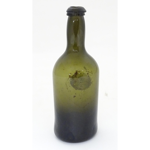 218 - A late 18thC / early 19thC sealed bottle, the light olive glass bottle with dragon seal. ( small siz... 