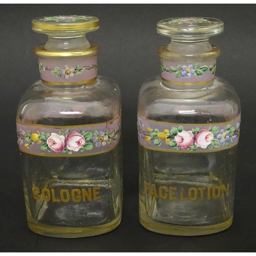 219 - A 19thC glass dressing table canisters: a pair hand painted clear glass canisters with stoppers each... 