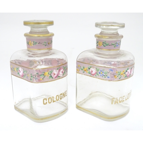 219 - A 19thC glass dressing table canisters: a pair hand painted clear glass canisters with stoppers each... 