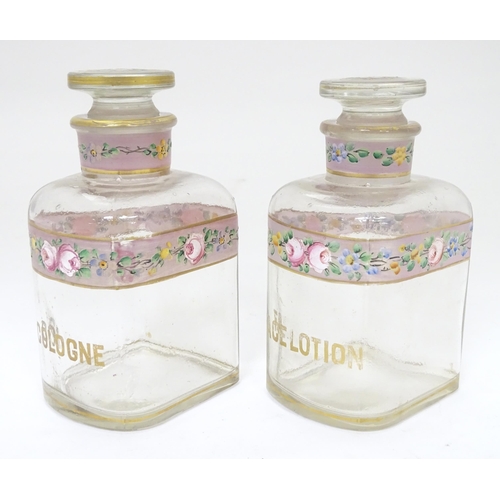 219 - A 19thC glass dressing table canisters: a pair hand painted clear glass canisters with stoppers each... 