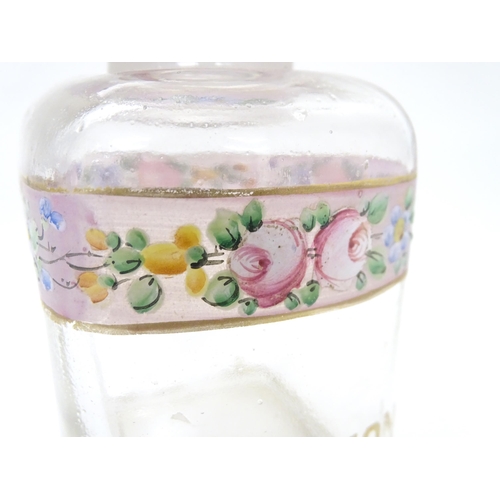 219 - A 19thC glass dressing table canisters: a pair hand painted clear glass canisters with stoppers each... 