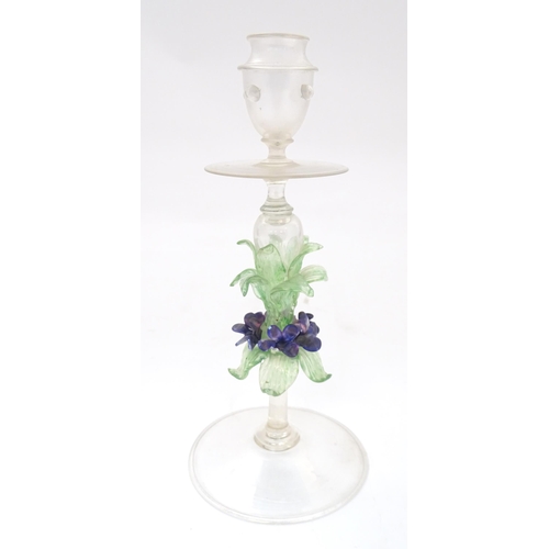 222 - A glass candlestick with floral detail to stem in the Venetian style. Approx. 11