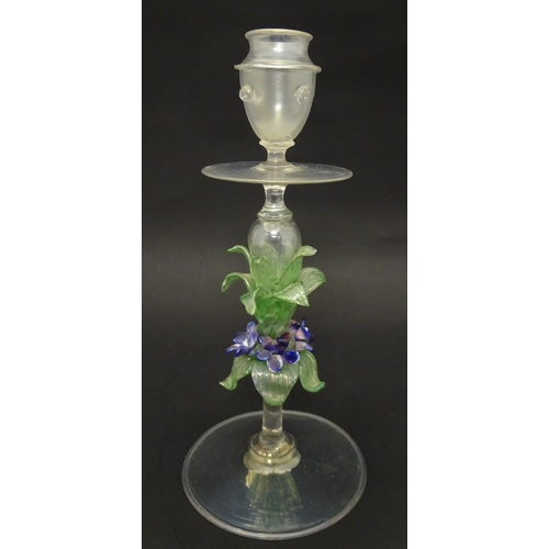 222 - A glass candlestick with floral detail to stem in the Venetian style. Approx. 11