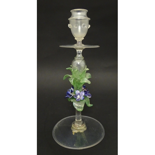 222 - A glass candlestick with floral detail to stem in the Venetian style. Approx. 11