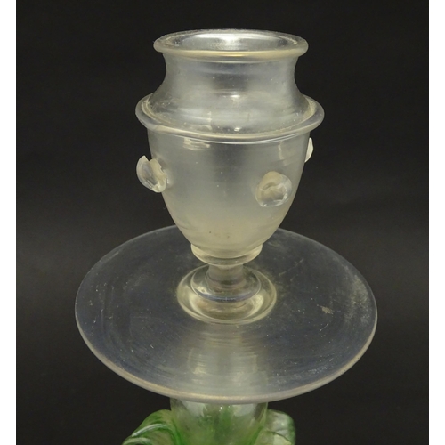 222 - A glass candlestick with floral detail to stem in the Venetian style. Approx. 11