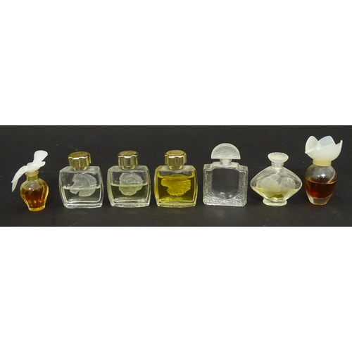 231 - A quantity of assorted miniature glass scent / perfume bottles, by Lalique, etc. (7)