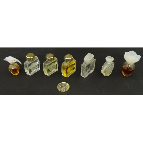 231 - A quantity of assorted miniature glass scent / perfume bottles, by Lalique, etc. (7)