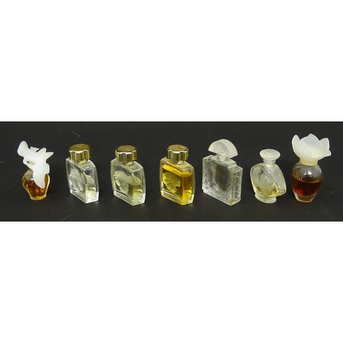 231 - A quantity of assorted miniature glass scent / perfume bottles, by Lalique, etc. (7)