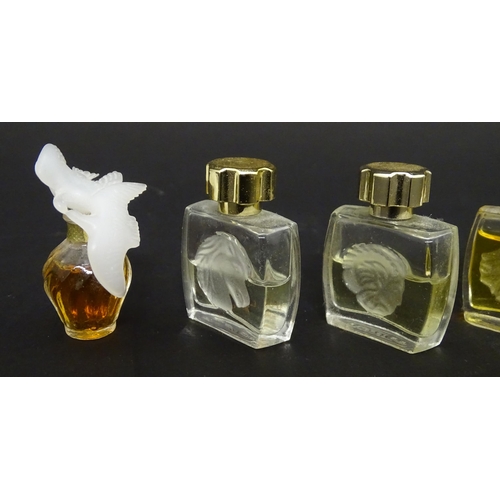 231 - A quantity of assorted miniature glass scent / perfume bottles, by Lalique, etc. (7)