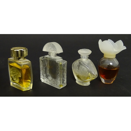 231 - A quantity of assorted miniature glass scent / perfume bottles, by Lalique, etc. (7)