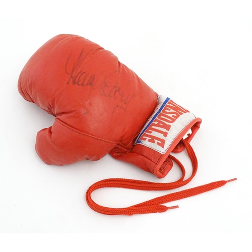 867 - Sporting memorabilia: a Lonsdale boxing glove, bearing the autograph of Sir Henry Cooper OBE KSG (19... 