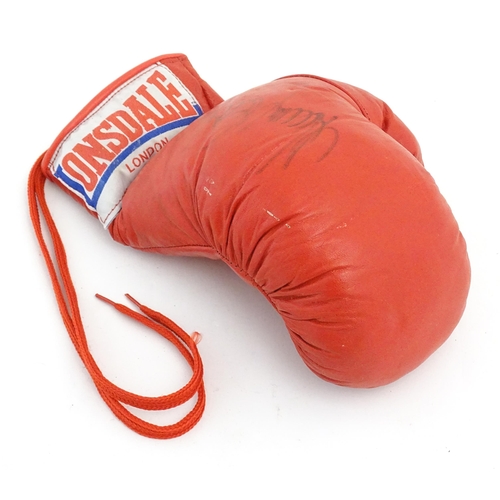 867 - Sporting memorabilia: a Lonsdale boxing glove, bearing the autograph of Sir Henry Cooper OBE KSG (19... 