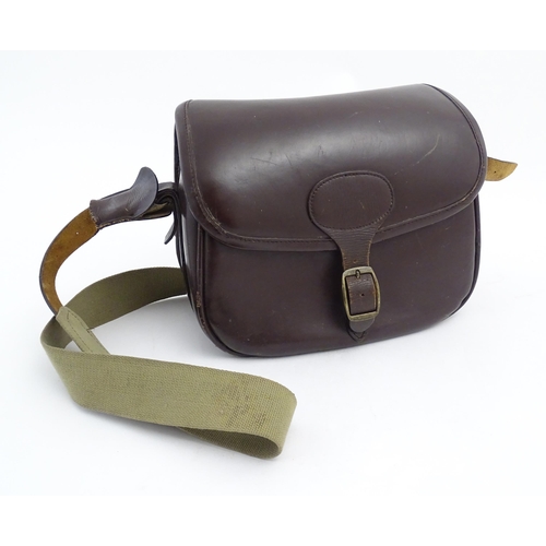 870 - Shooting : a large cartridge bag, constructed from leather with lined interior and canvas strap, pro... 