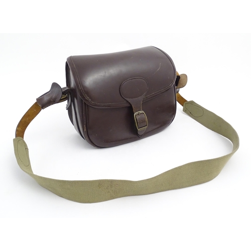 870 - Shooting : a large cartridge bag, constructed from leather with lined interior and canvas strap, pro... 