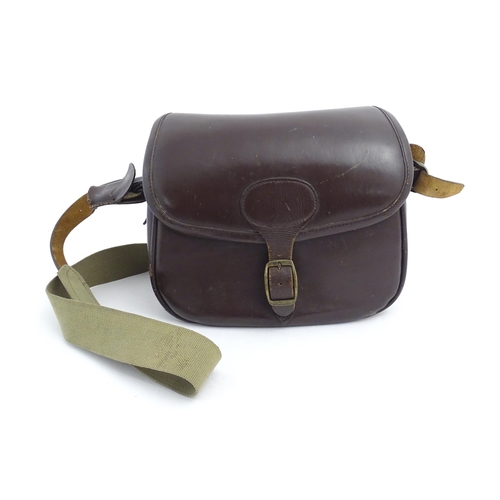 870 - Shooting : a large cartridge bag, constructed from leather with lined interior and canvas strap, pro... 