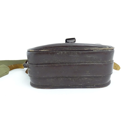 870 - Shooting : a large cartridge bag, constructed from leather with lined interior and canvas strap, pro... 