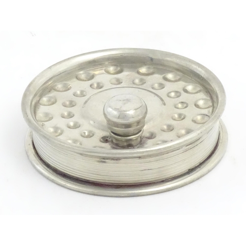 871 - Fishing : a novelty hip flask formed as a centrepin fly reel, the underside decorated with trout fis... 