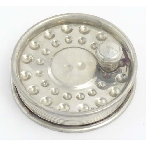 871 - Fishing : a novelty hip flask formed as a centrepin fly reel, the underside decorated with trout fis... 