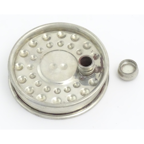 871 - Fishing : a novelty hip flask formed as a centrepin fly reel, the underside decorated with trout fis... 